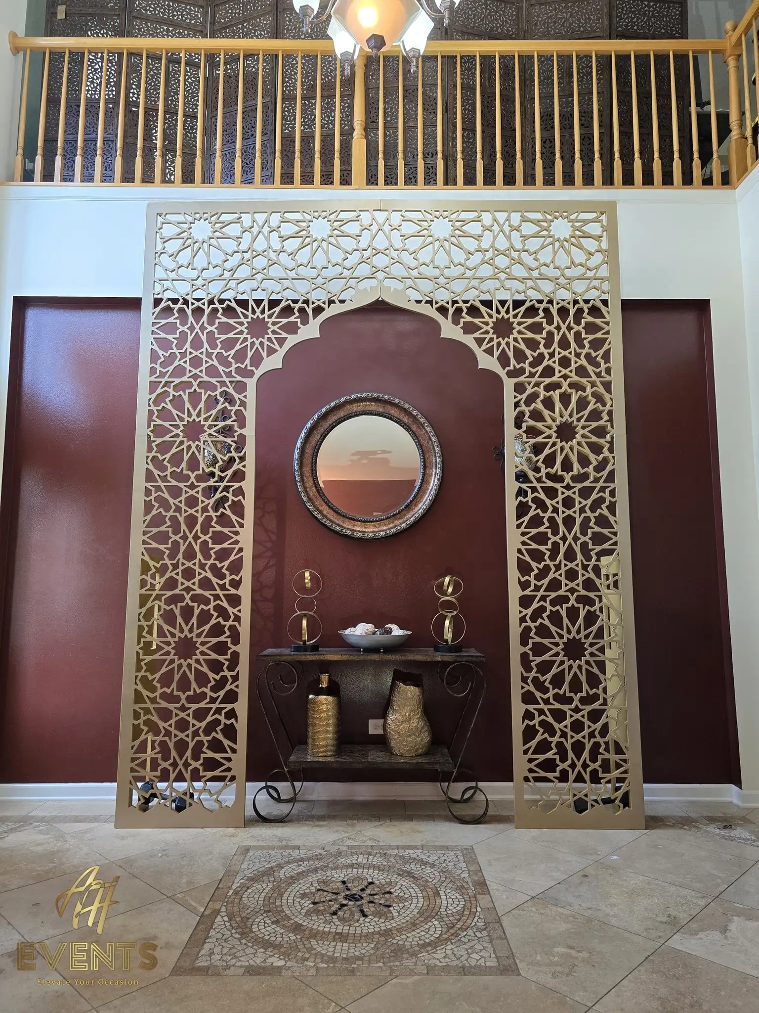 Champagne-gold star-lattice matrix arch (Metallic Champagne Mist) in a home foyer with a round mirror and console
