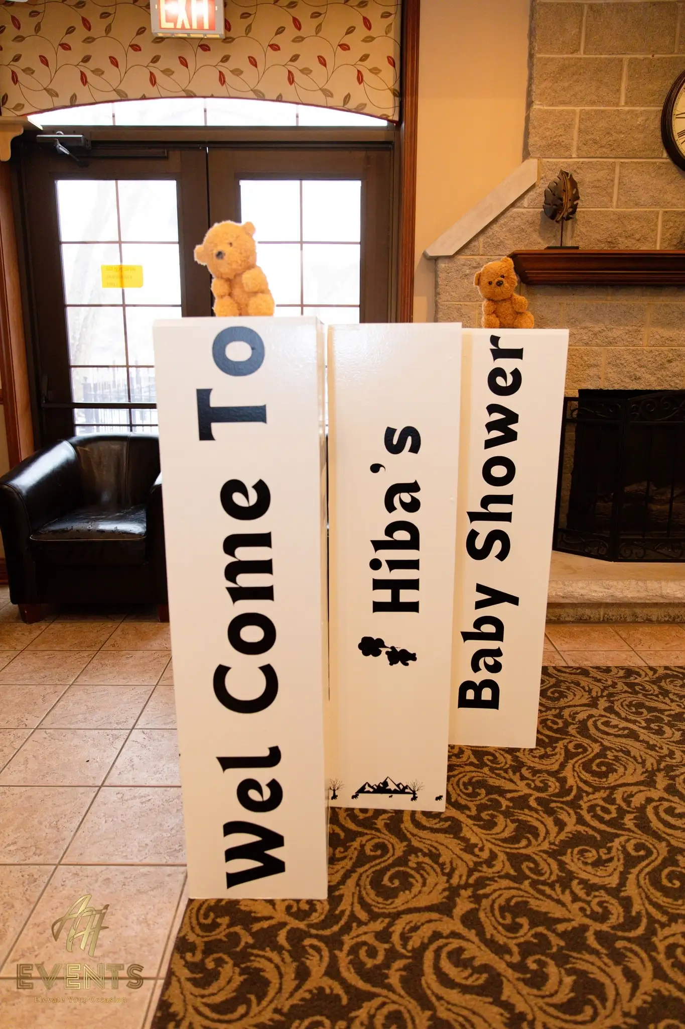 Tall standing letter boards reading 'Welcome to Hiba's Baby Shower', topped with teddy bears