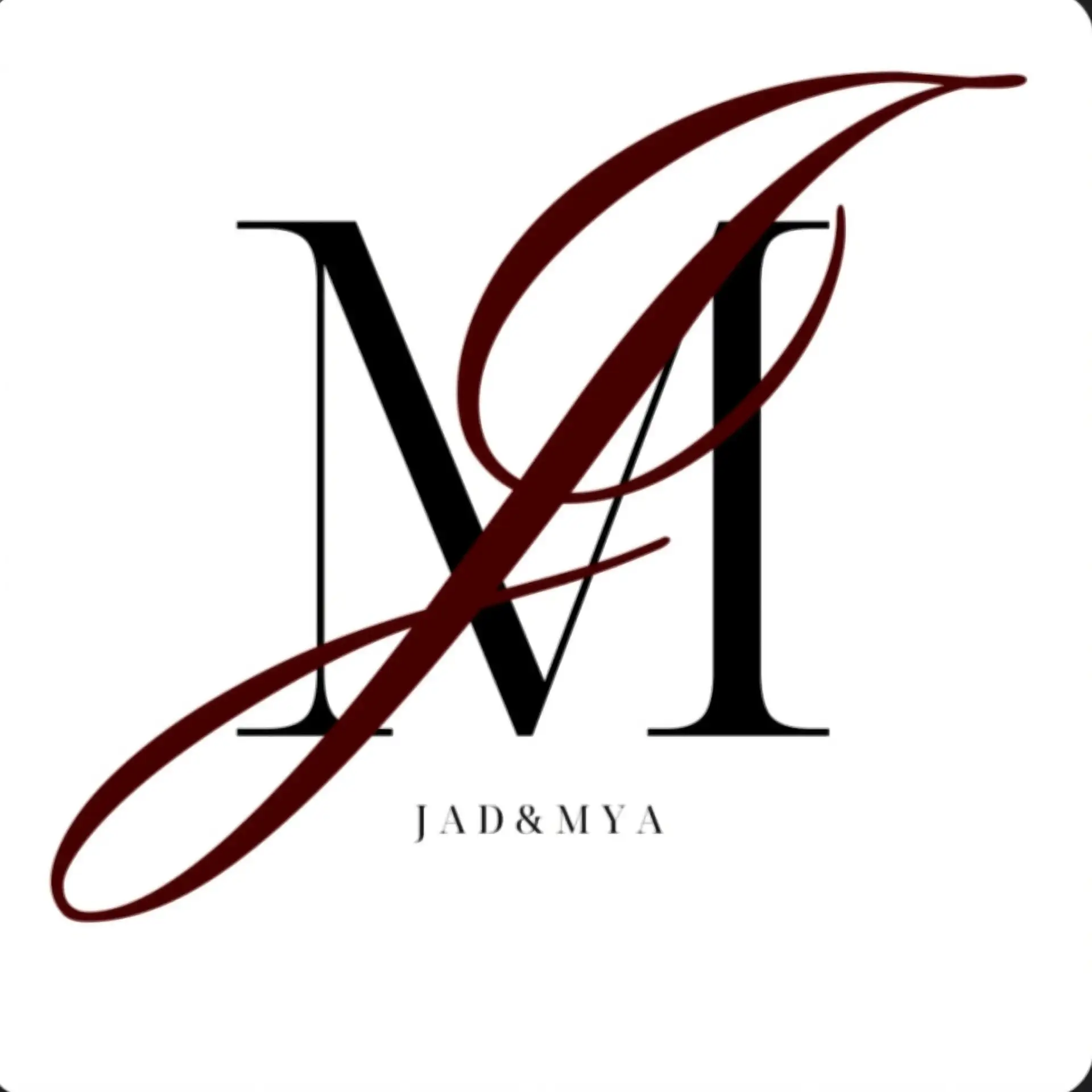 Custom dance-floor monogram for Jad & Mya — an interlocking maroon script 'J' and black serif 'M' above the couple's names.