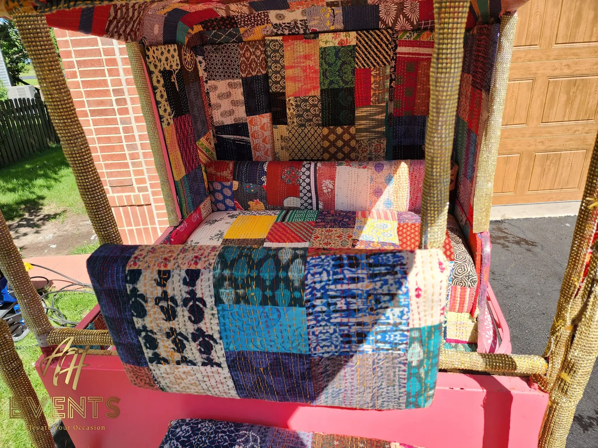 Close-up of the auto rickshaw's patchwork quilted seat cushions