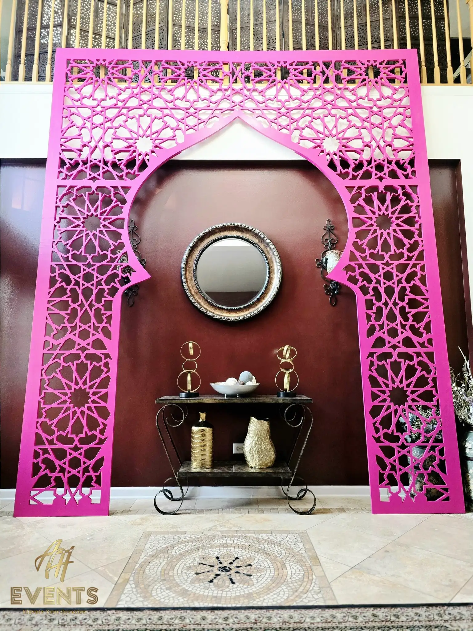 Pink lattice matrix arch displayed in a home foyer, front view showing the intricate geometric cut pattern