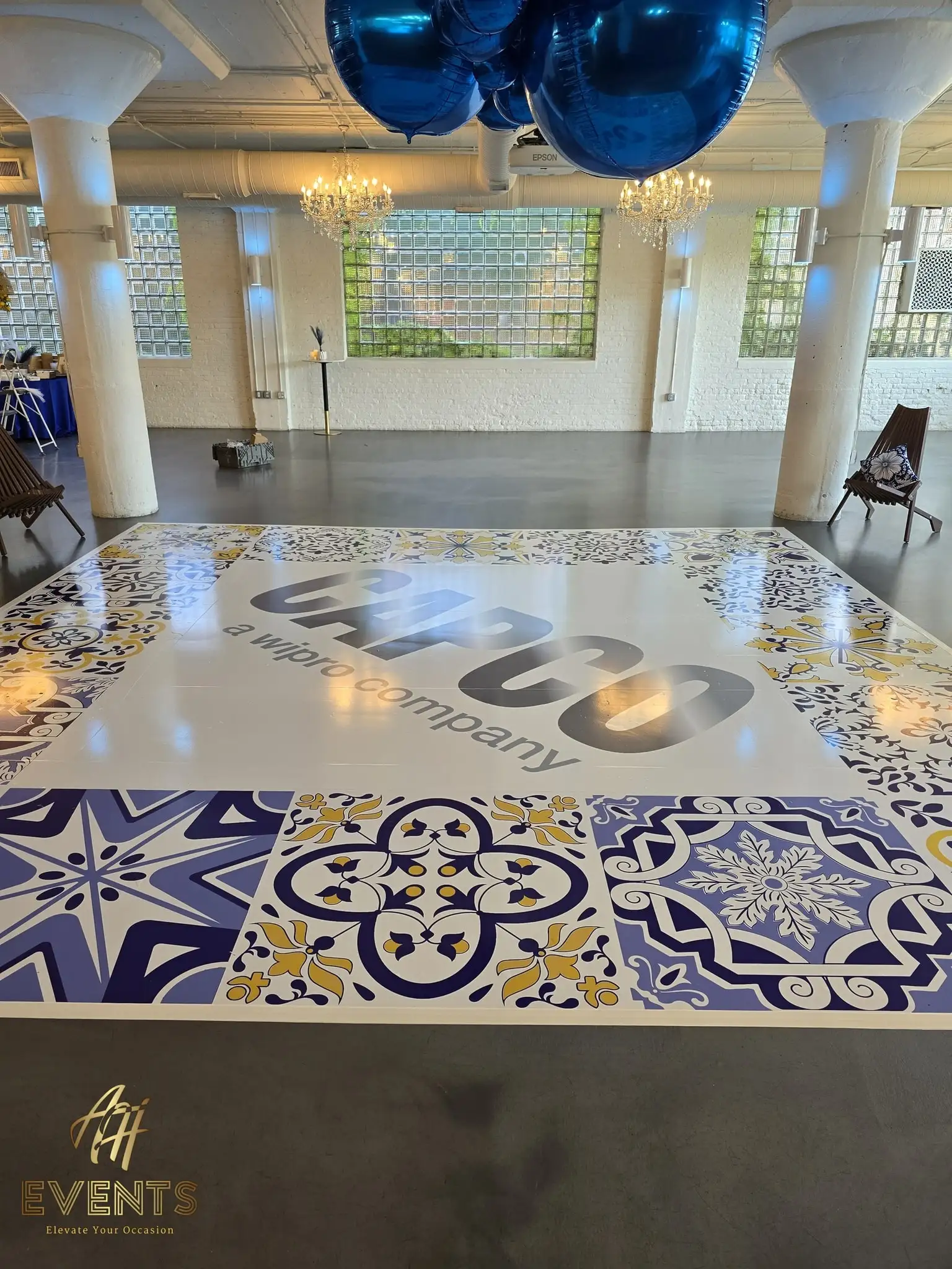 The CAPCO tiled dance floor viewed toward the greenery-screened windows of the loft