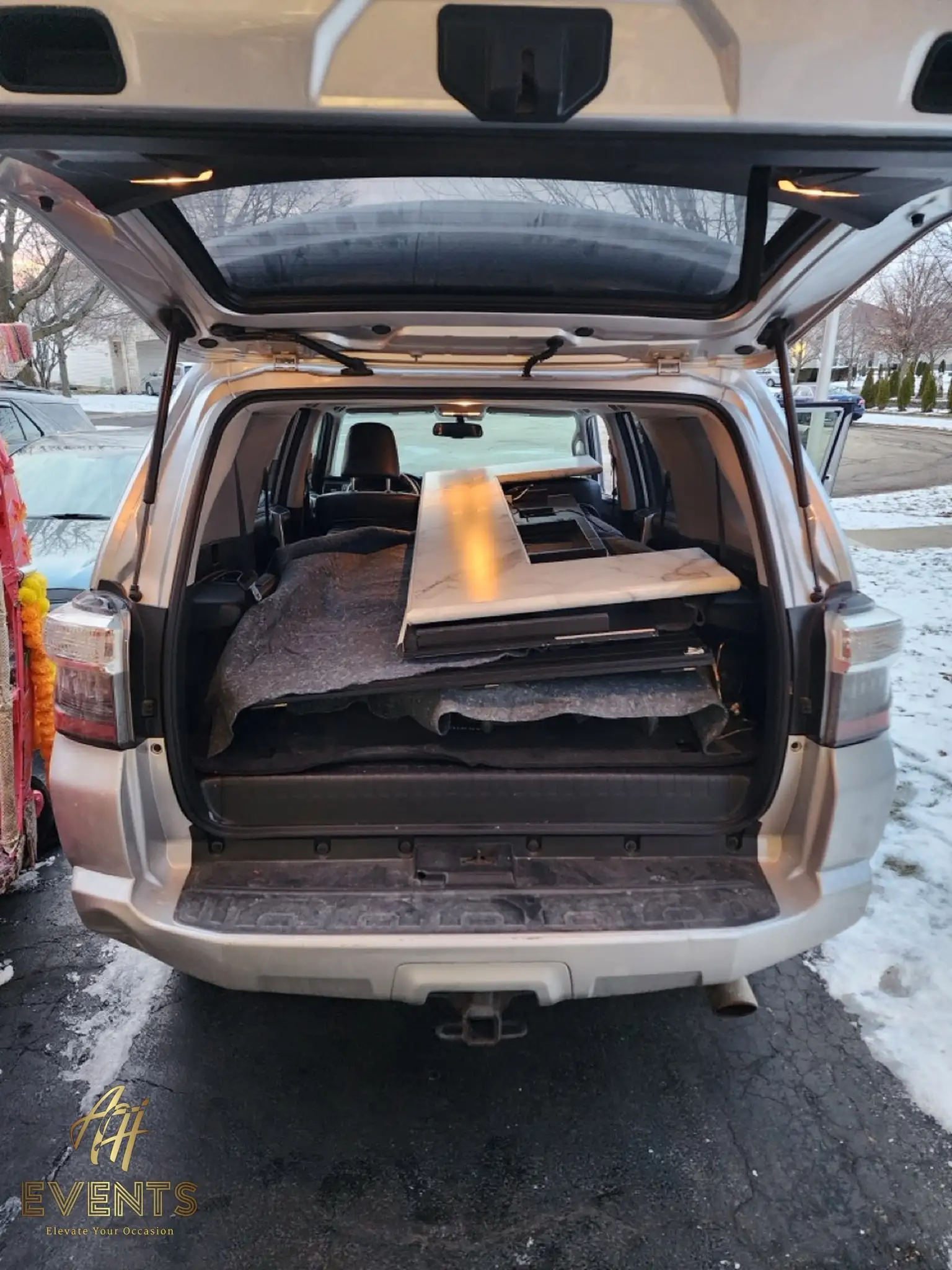 Folded Bobawala cart packed flat into an SUV trunk, showing how it breaks down for transport
