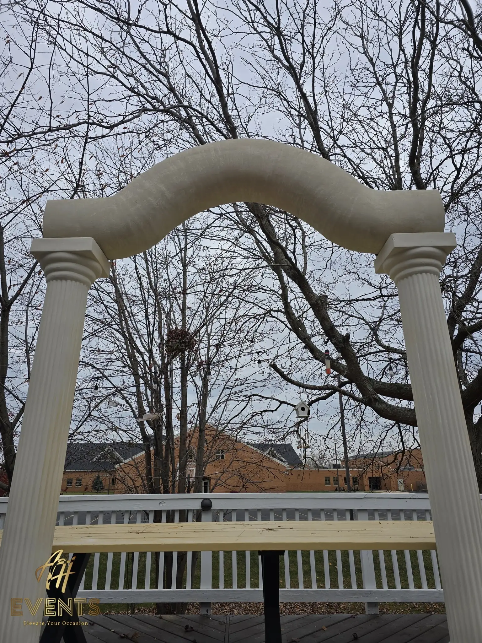 The classical-pillar arch with fluted columns on the deck, slightly angled view