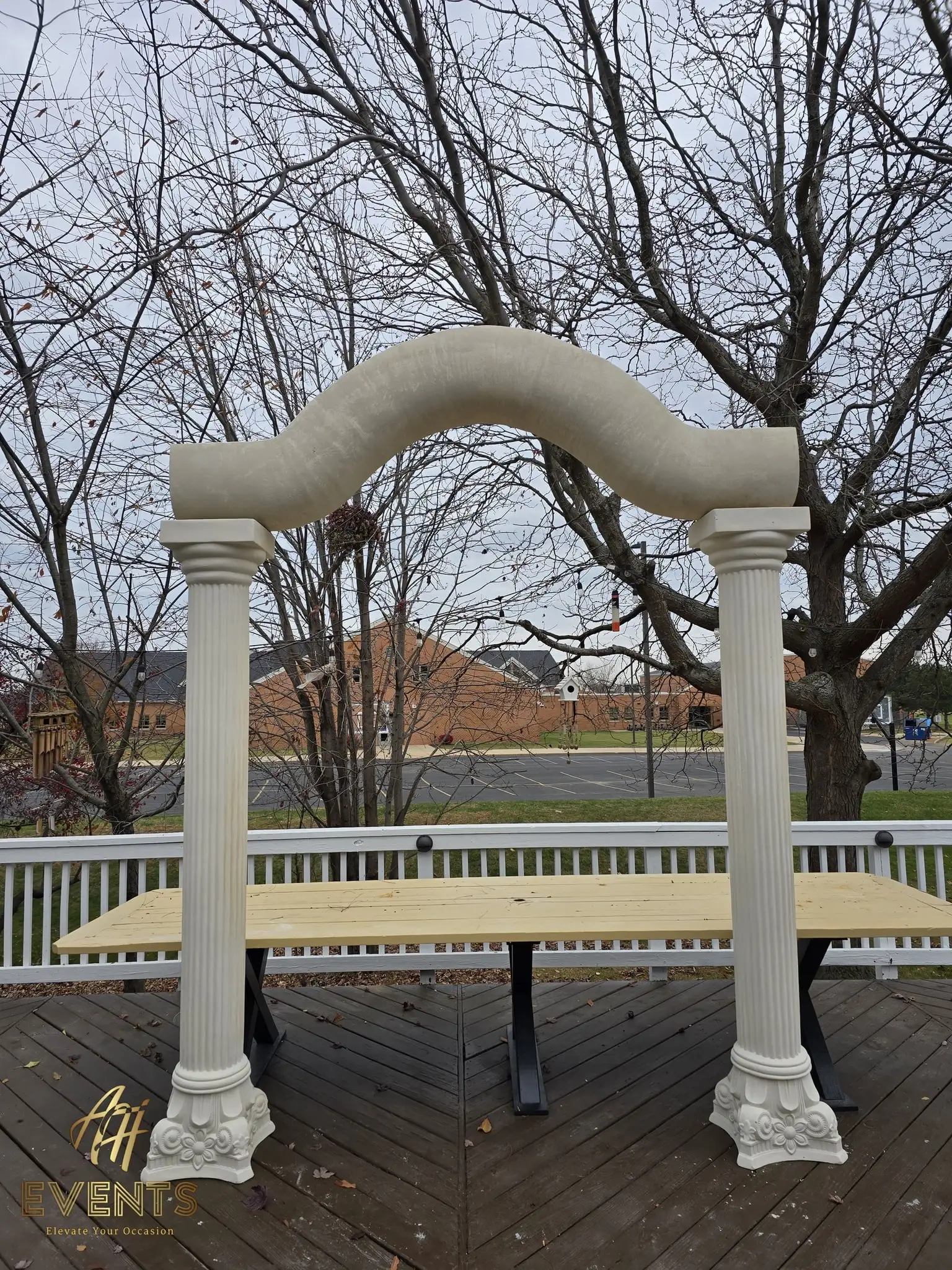 Serpentine arch and fluted columns over the plywood stage base on the deck