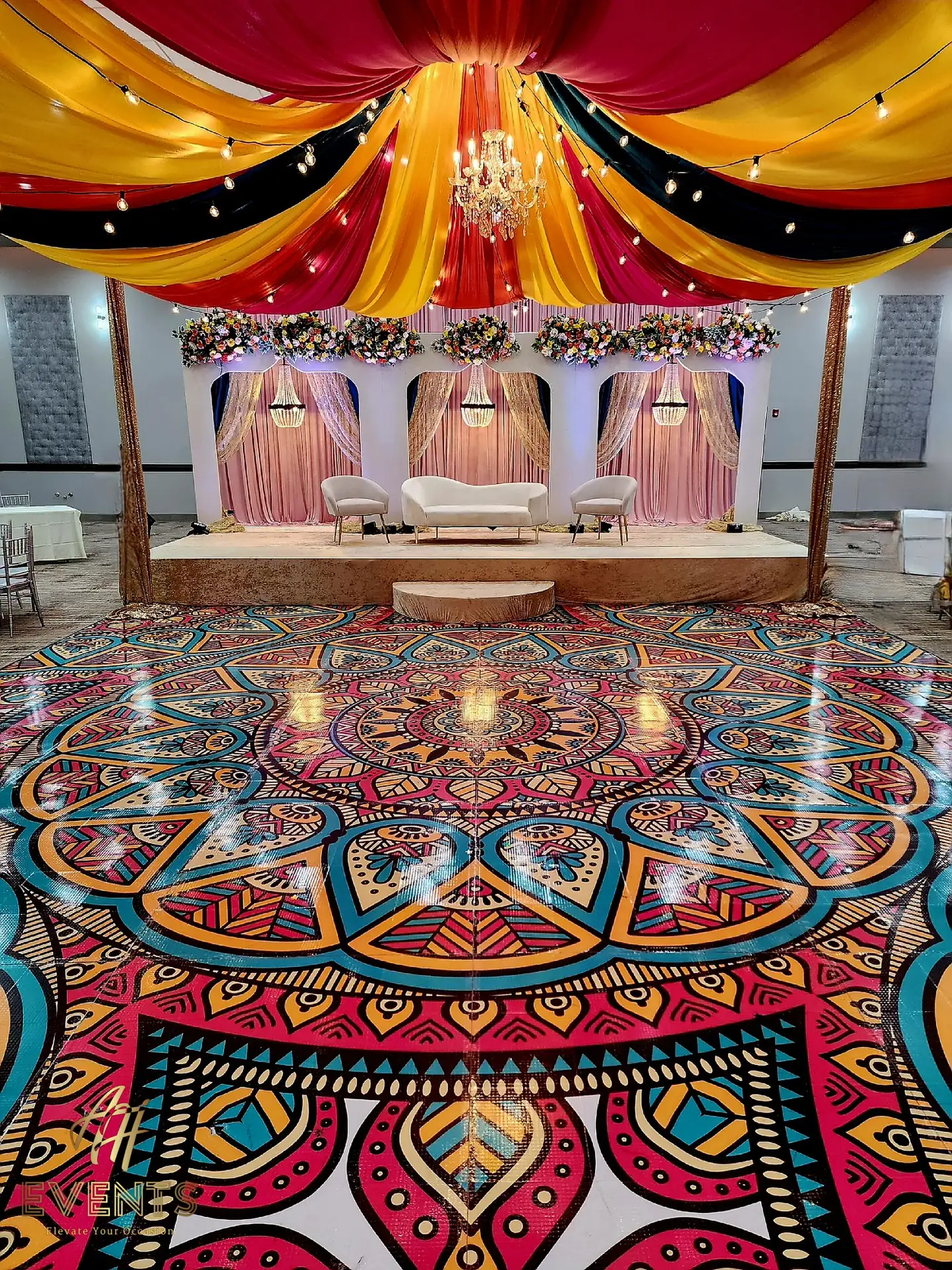 A colorful dance floor with a mandala design on it